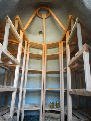 Interior of earthbag structure with shelves