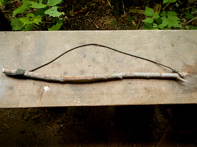 bowline knot on a bow from a friction fire set