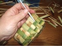 adjusting the weave of a cattail basket
