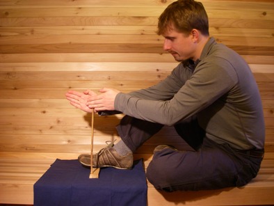 demonstrating the proper handdrill form