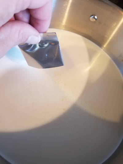 adding cheese cultures to the milk