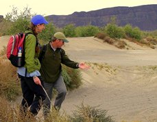 Student trailing deer with instructor