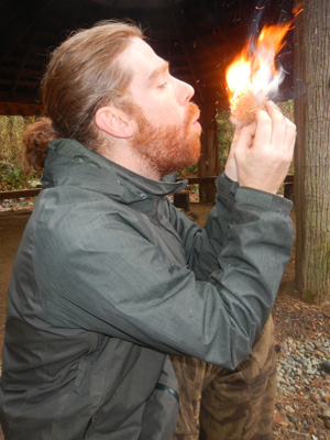 Instructor Gabe making fire