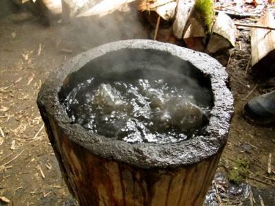 a coal-burned bowl boiling water