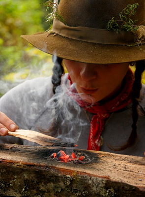 a coal-burned bowl being made for surivival water purification